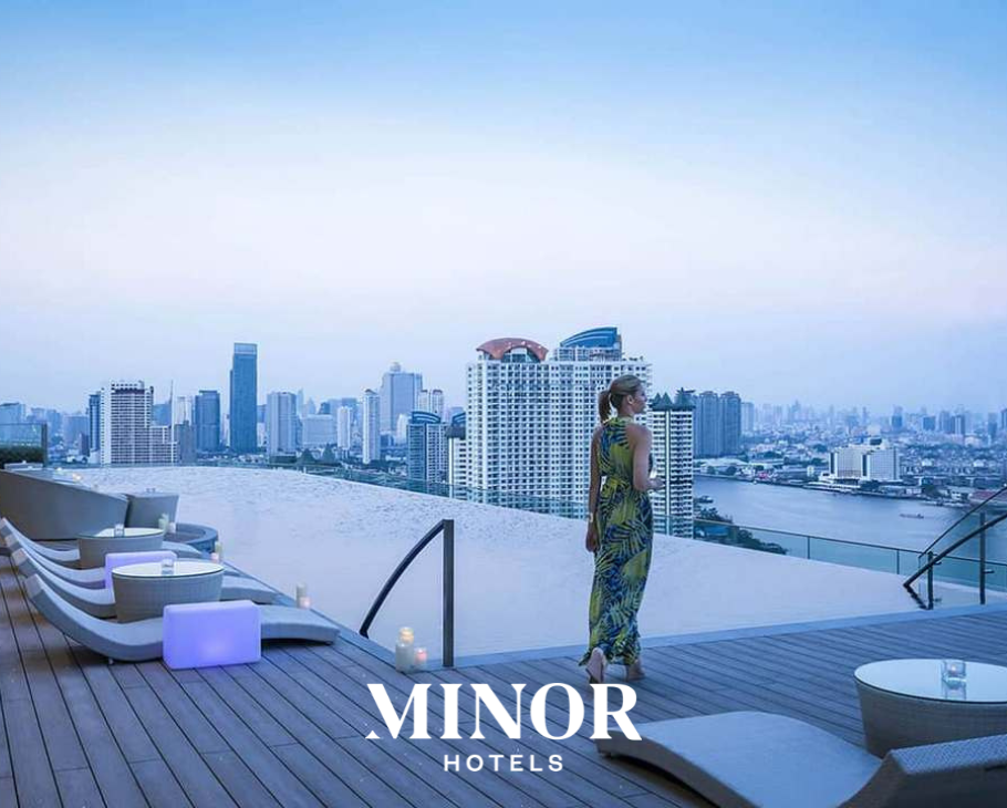 Minor Hotels logo overlayed on image of rooftop pool overlooking bangkok skyline and lady standing by pool. Venue for 2026 Skift Asia Forum. 
