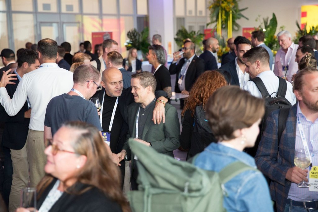 group of people and teams attend skift global forum